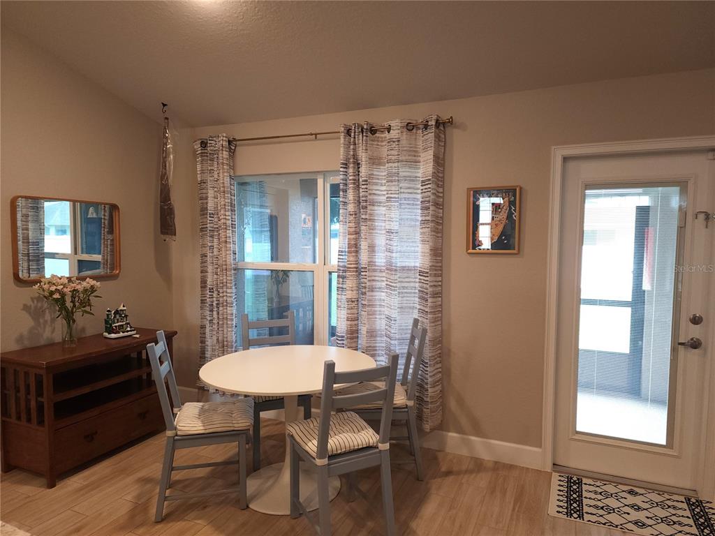 9148 Southeast 49th Avenue Road Ocala, FL 34480 - Photo 10 of 22 a view of a room with a table and chairs