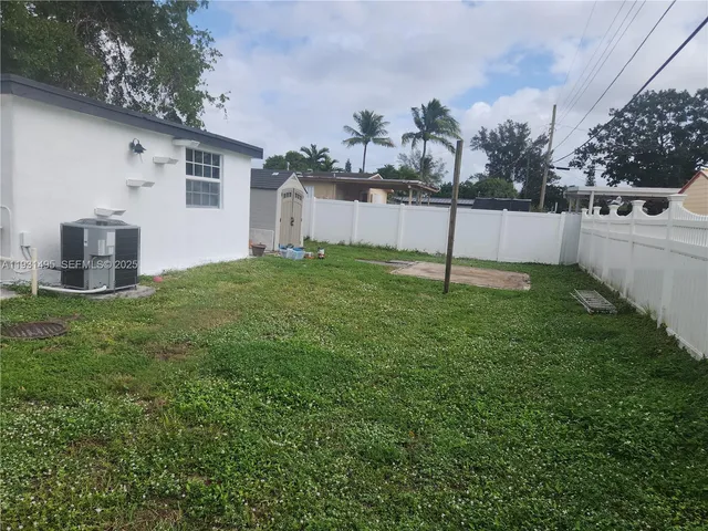 a view of a room with furniture and wooden floor