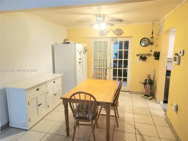 a spacious bathroom with a granite countertop sink a mirror and a shower