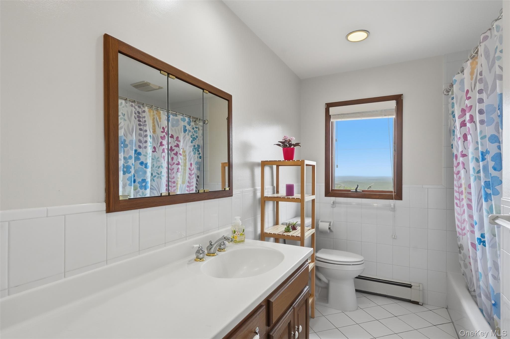 6 Horizon Road Cornwall, NY 12518 - Photo 26 of 33 a bathroom with a sink vanity mirror and toilet