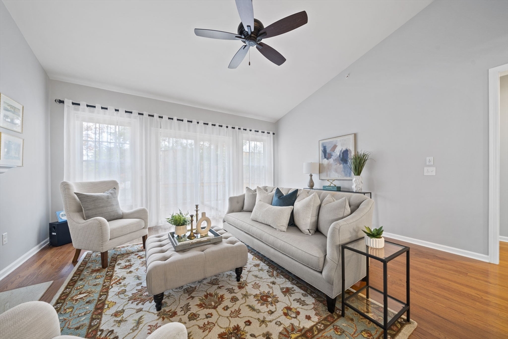 33 Kelly Way, Unit 33 Canton, MA 02021 - Photo 13 of 42 a living room with furniture and a wooden floor