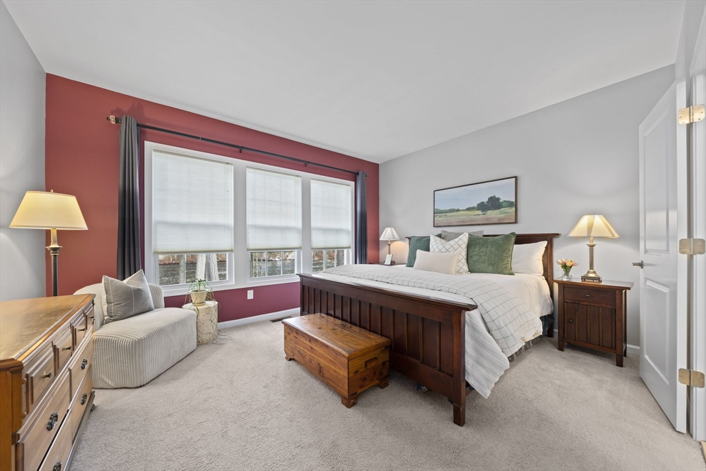 33 Kelly Way, Unit 33 Canton, MA 02021 - Photo 15 of 42 a spacious bedroom with a bed and a large window