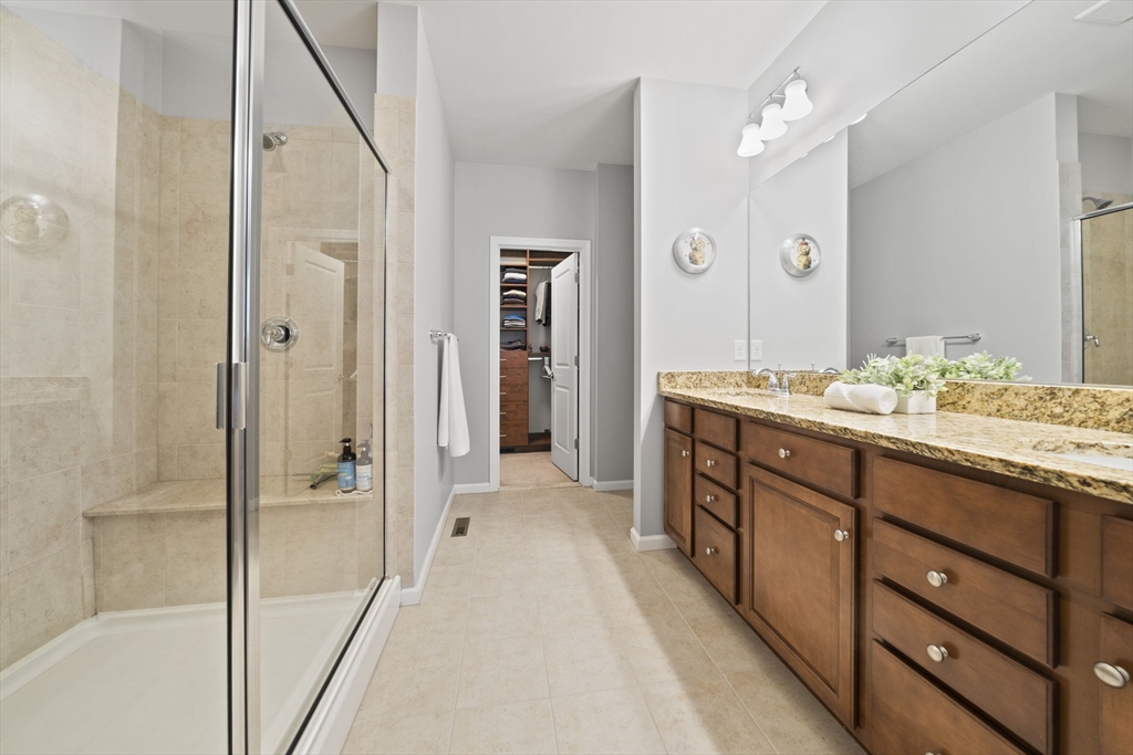 33 Kelly Way, Unit 33 Canton, MA 02021 - Photo 17 of 42 a spacious bathroom with a double vanity sink and a mirror
