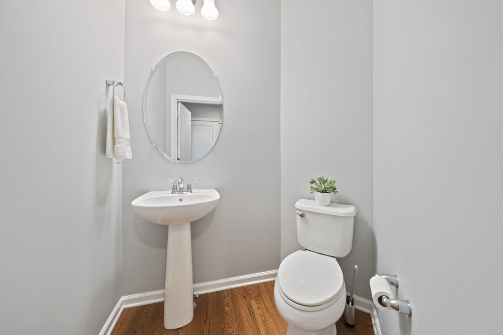 33 Kelly Way, Unit 33 Canton, MA 02021 - Photo 19 of 42 a bathroom with a toilet a sink and a mirror