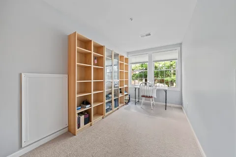 a view of a room with a large window