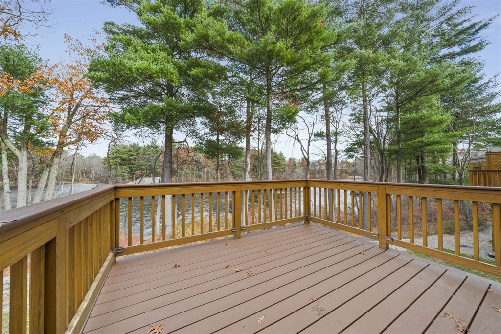 33 Kelly Way, Unit 33 Canton, MA 02021 - Photo 29 of 42 a view of balcony with wooden floor and fence