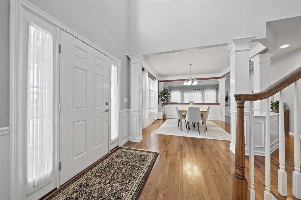 33 Kelly Way, Unit 33 Canton, MA 02021 - Photo 9 of 42 a dining room with wooden floor and furniture