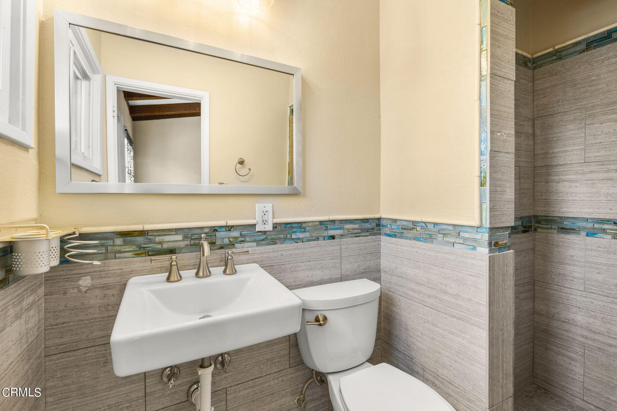 3131 Armada Drive Ventura, CA 93003 - Photo 16 of 31 a bathroom with a toilet a sink and mirror