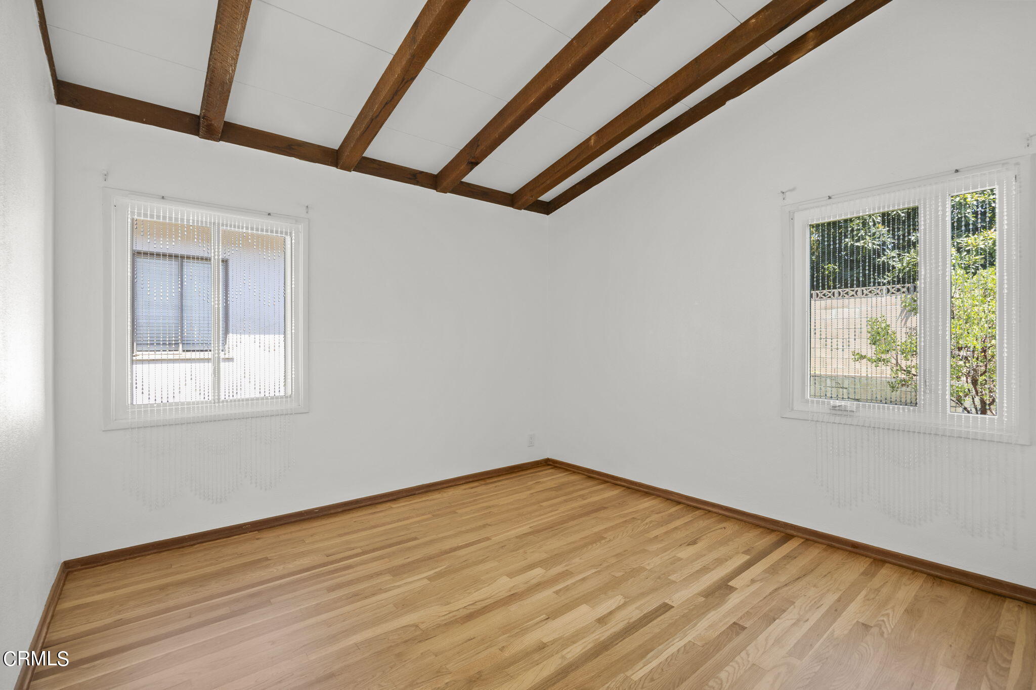 3131 Armada Drive Ventura, CA 93003 - Photo 21 of 31 a view of empty room with wooden floor and fan