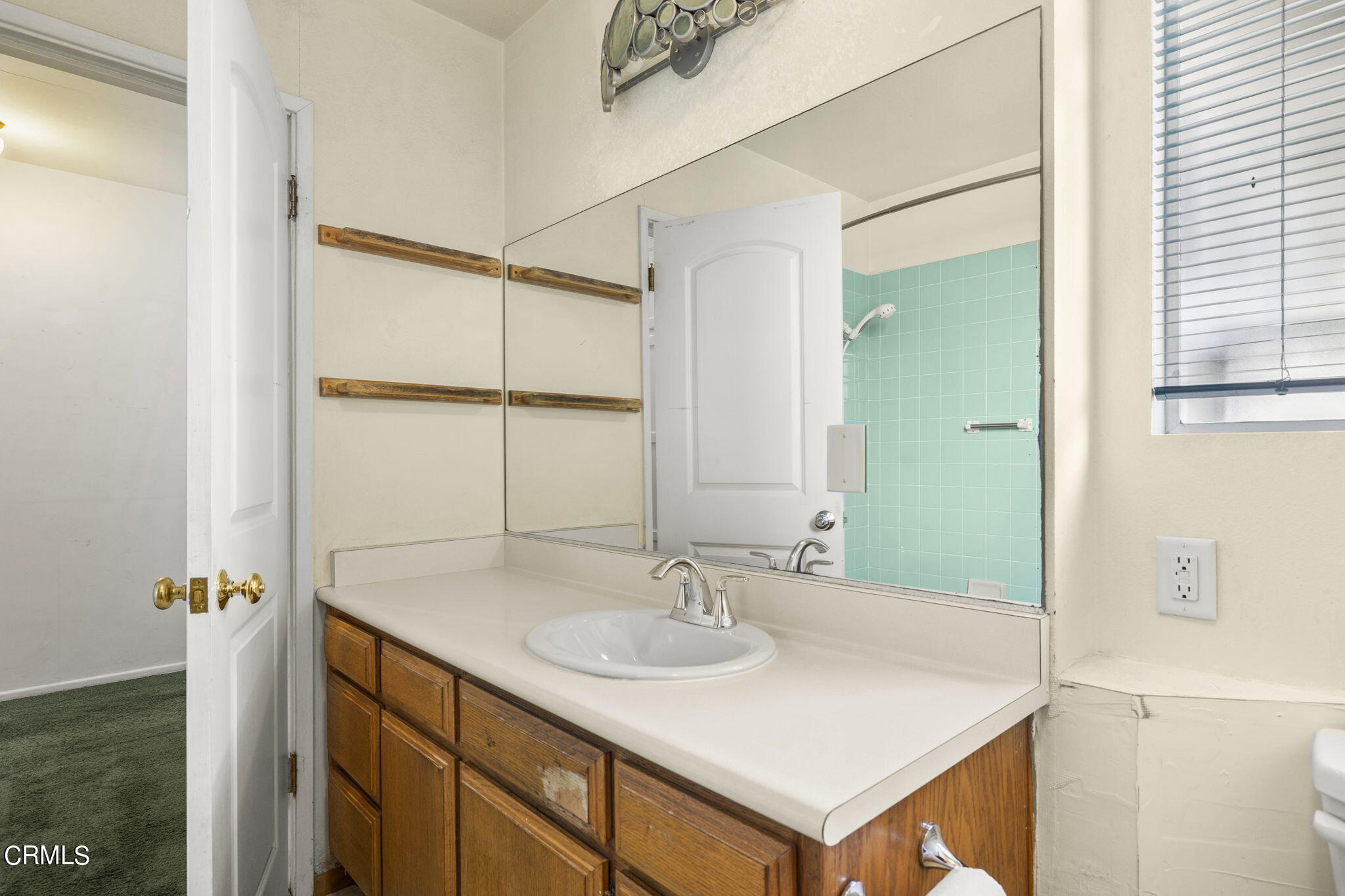 3131 Armada Drive Ventura, CA 93003 - Photo 23 of 31 a bathroom with a sink and a mirror