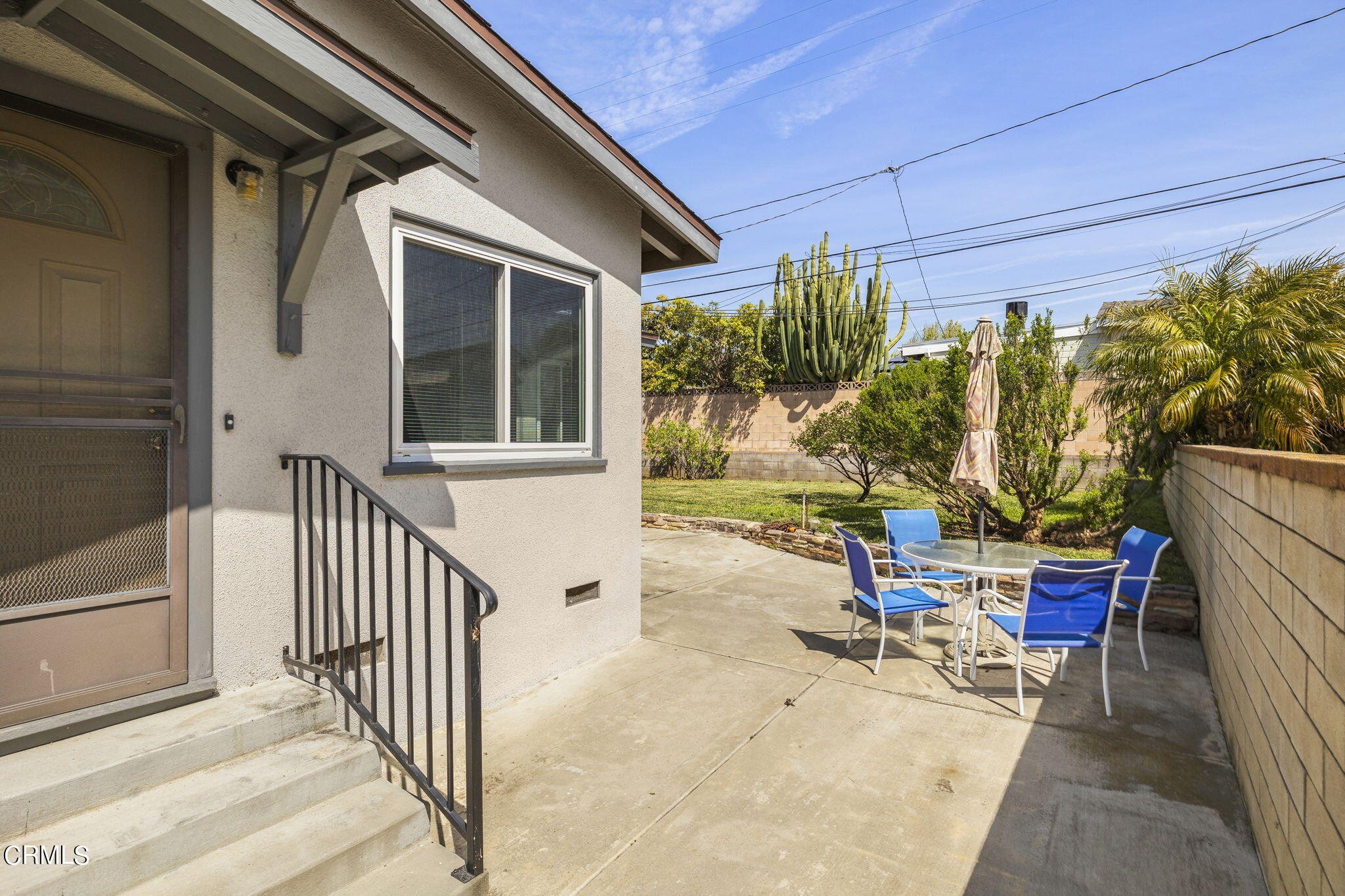 3131 Armada Drive Ventura, CA 93003 - Photo 25 of 31 a view of a patio with a table and chairs and potted plants
