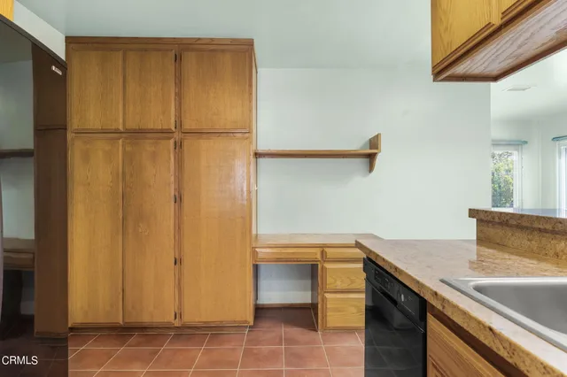 a bathroom with a sink and a white cabinet