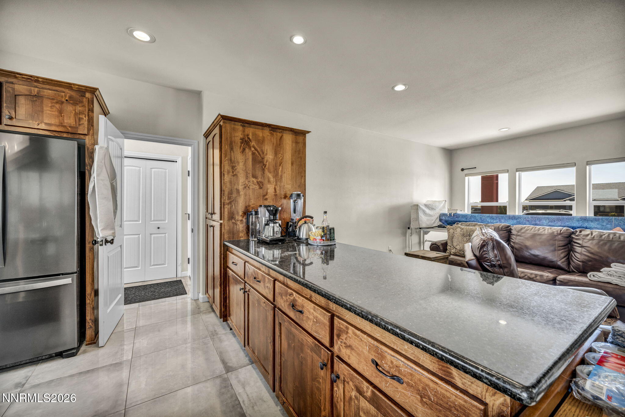 1286 Sky Ridge Drive Fallon, NV 89406 - Photo 11 of 49 a kitchen with stainless steel appliances granite countertop a refrigerator and a sink
