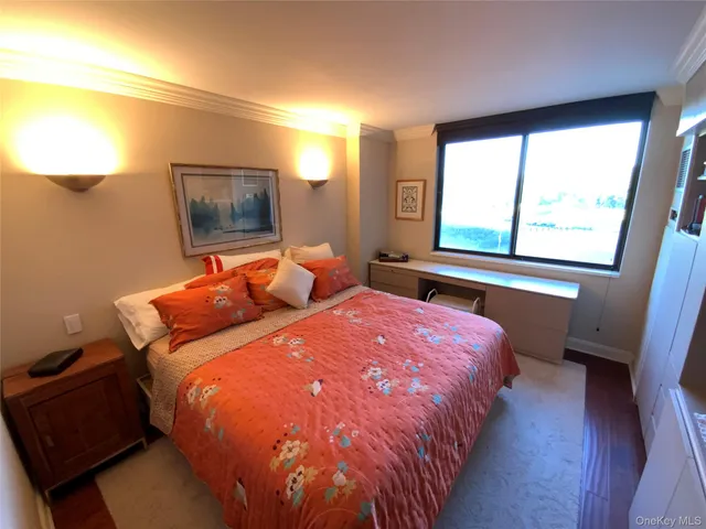 a bedroom with bed and window