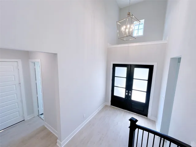 a view of a hallway with staircase