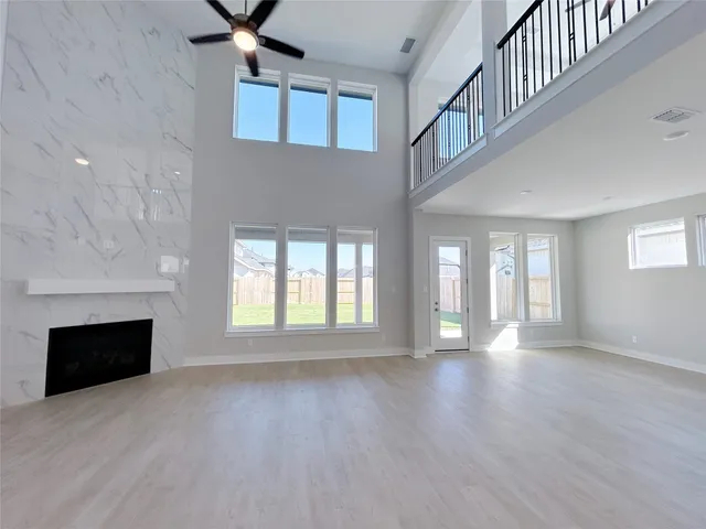 a view of a kitchen with a sink and a fireplace