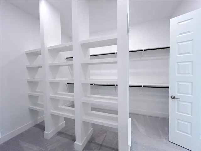 a bathroom with a double vanity sink a mirror and a shower