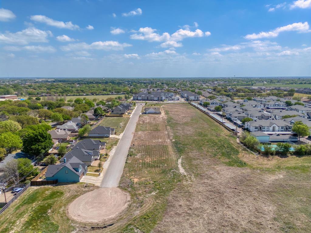 1516 Tranquility Trail Waco, TX 76712 - Photo 3 of 10 a view of a swimming pool with a yard and lake view in back