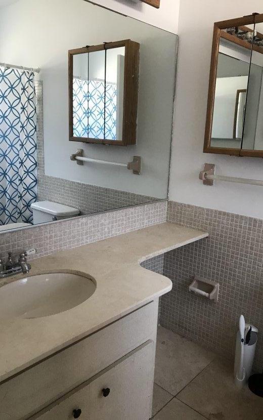 22705 Southwest 65th Terrace Boca Raton, FL 33428 - Photo 8 of 15 a bathroom with a sink and a mirror