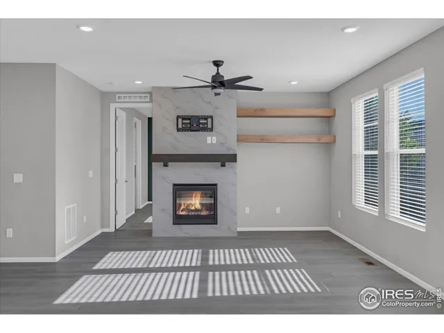 a kitchen with kitchen island granite countertop a sink a stove and a refrigerator