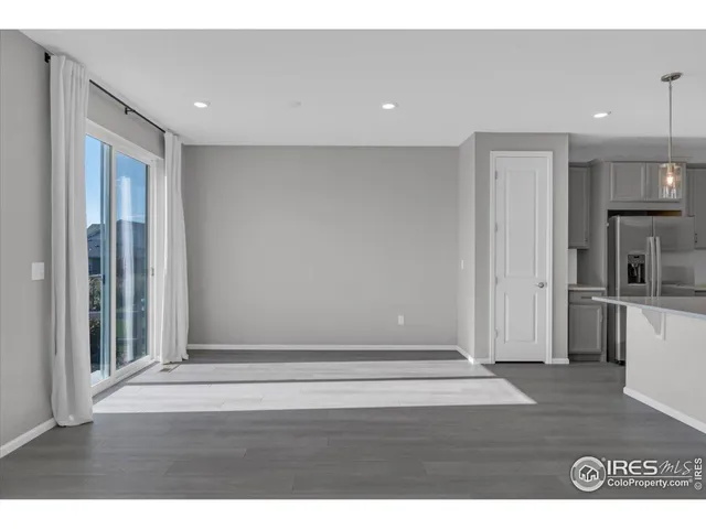 a kitchen with kitchen island a sink stainless steel appliances and cabinets