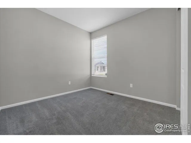 a bathroom with a granite countertop sink mirror and shower
