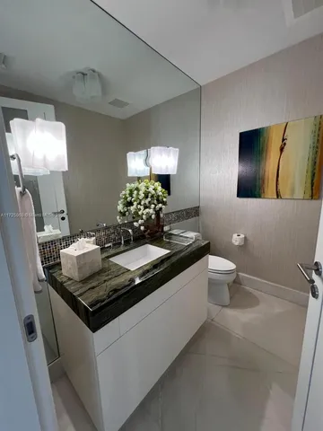 a kitchen with a sink and stove