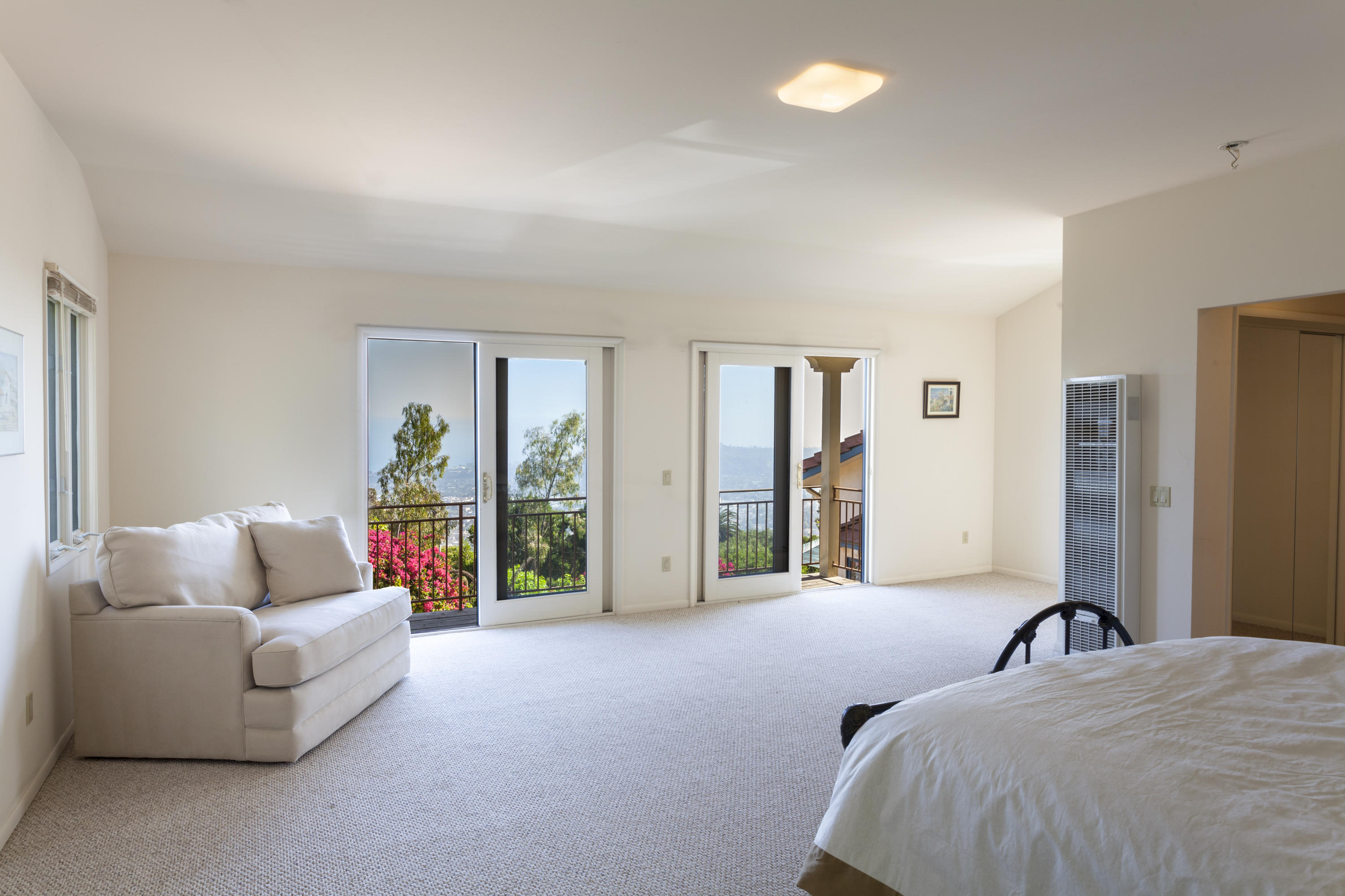 1568 Franceschi Road Santa Barbara, CA 93103 - Photo 12 of 16 a bed room with furniture and a large window