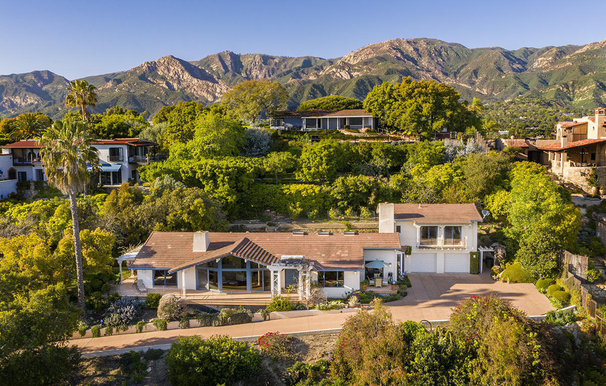 1568 Franceschi Road Santa Barbara, CA 93103 - Photo 14 of 16 front view of a house with a yard and large trees