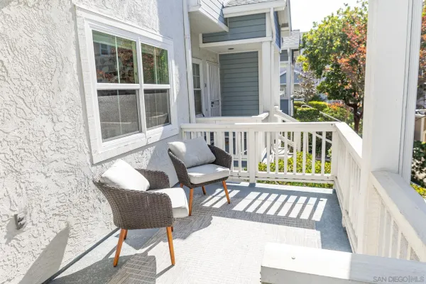 a view of porch with a bench