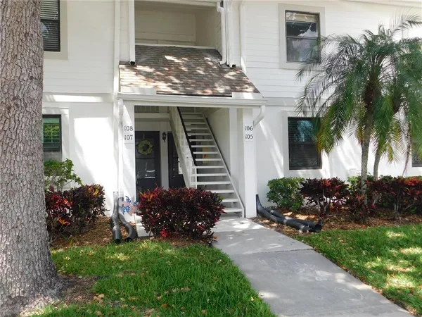 a view of a house with a yard and plants