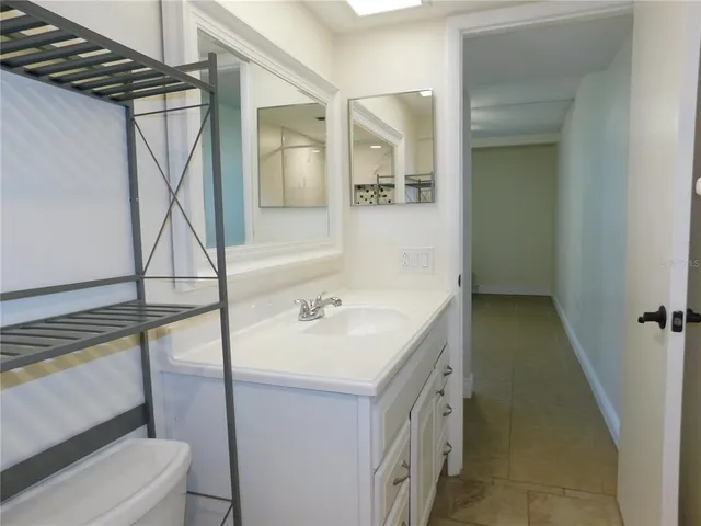 a bathroom with a sink and mirror