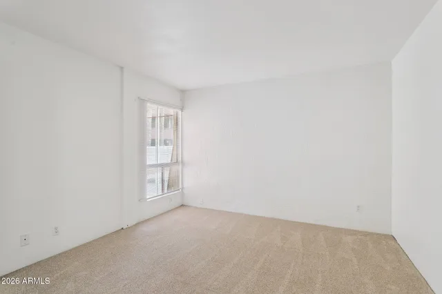 a view of an empty room and window