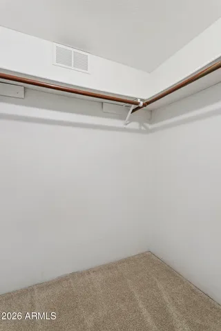 a view of a room with shelf on the wall