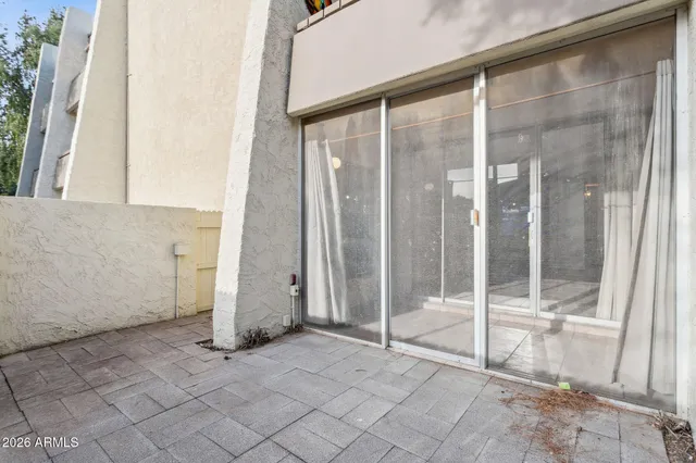 a bathroom with a glass door shower and a sink