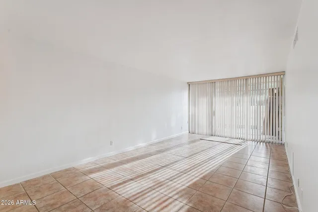 a view of an empty room and window