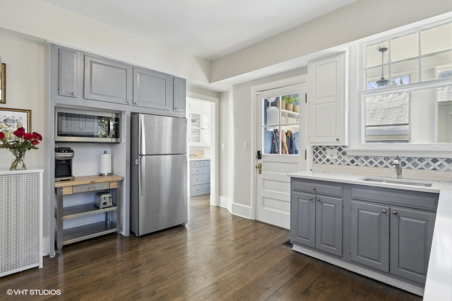 160 Sheridan Road Glencoe, IL 60093 - Photo 17 of 46 a kitchen with a refrigerator sink and cabinets