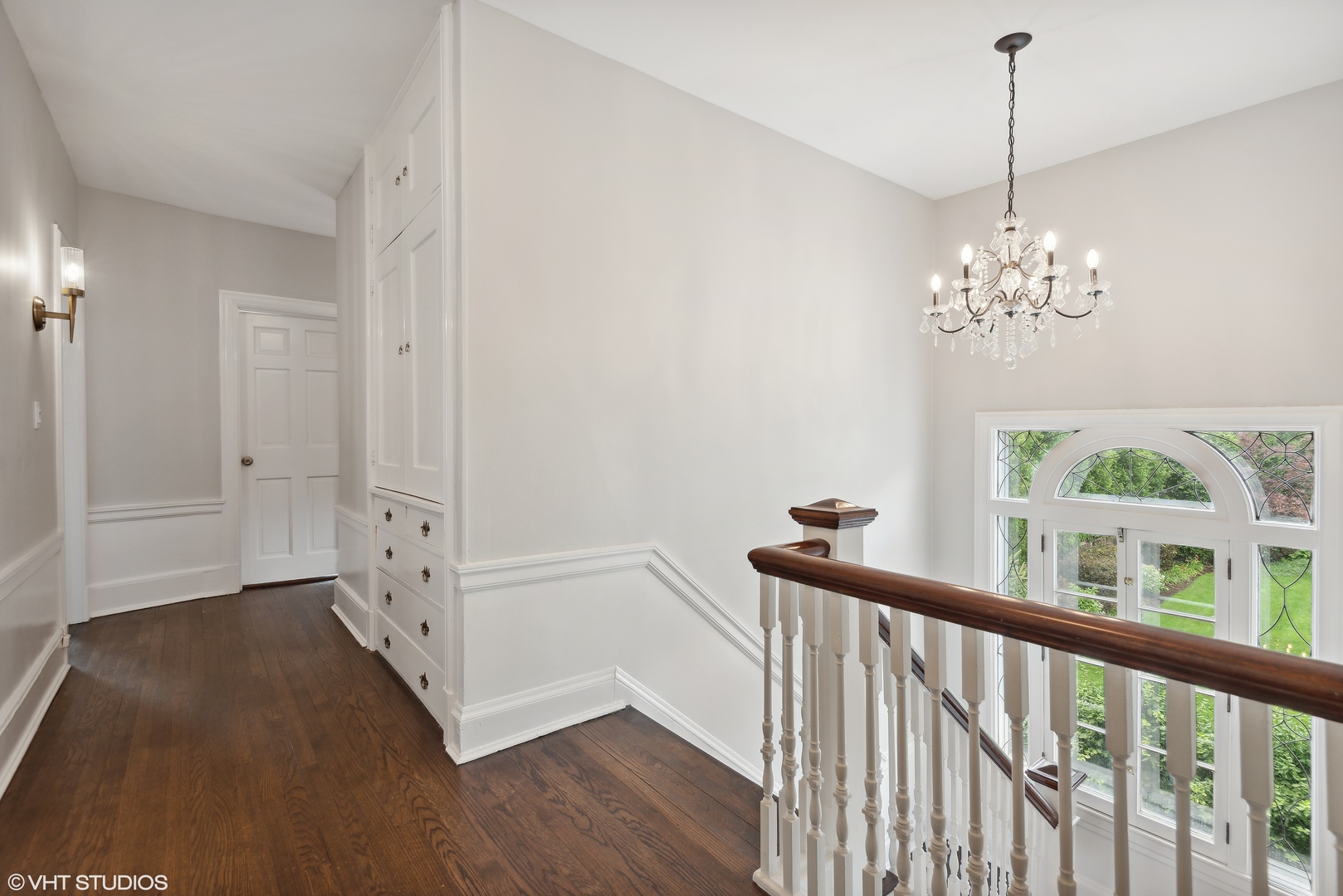 160 Sheridan Road Glencoe, IL 60093 - Photo 24 of 46 a view of a hallway with windows and chandelier