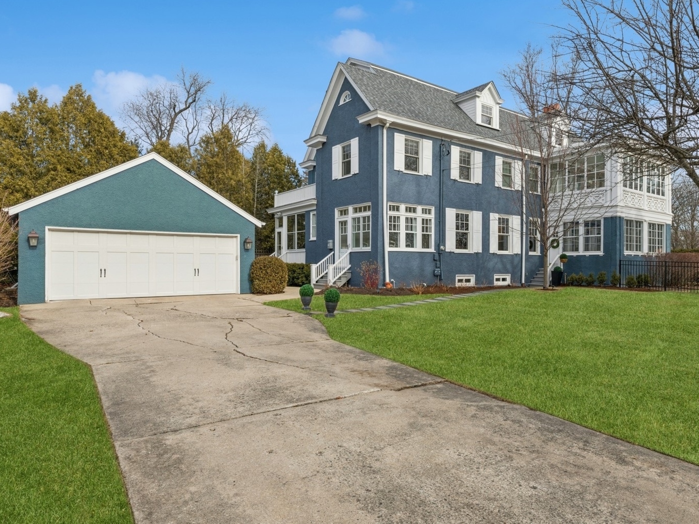 160 Sheridan Road Glencoe, IL 60093 - Photo 38 of 46 a front view of a building with a garden and plants