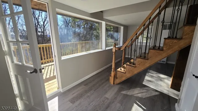 a view of a dining room with furniture and window