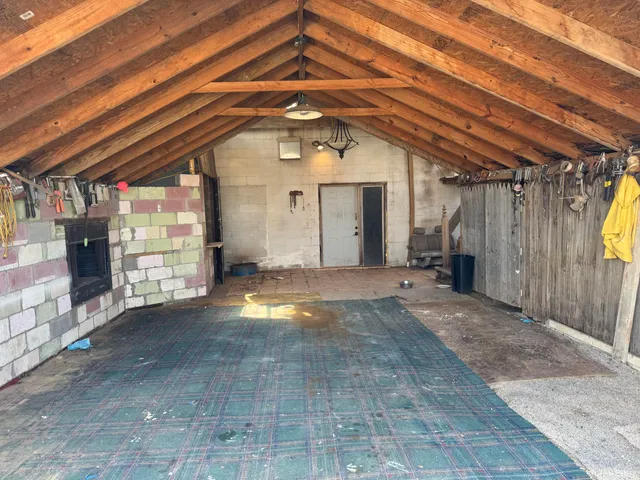 a view of a room with wooden walls