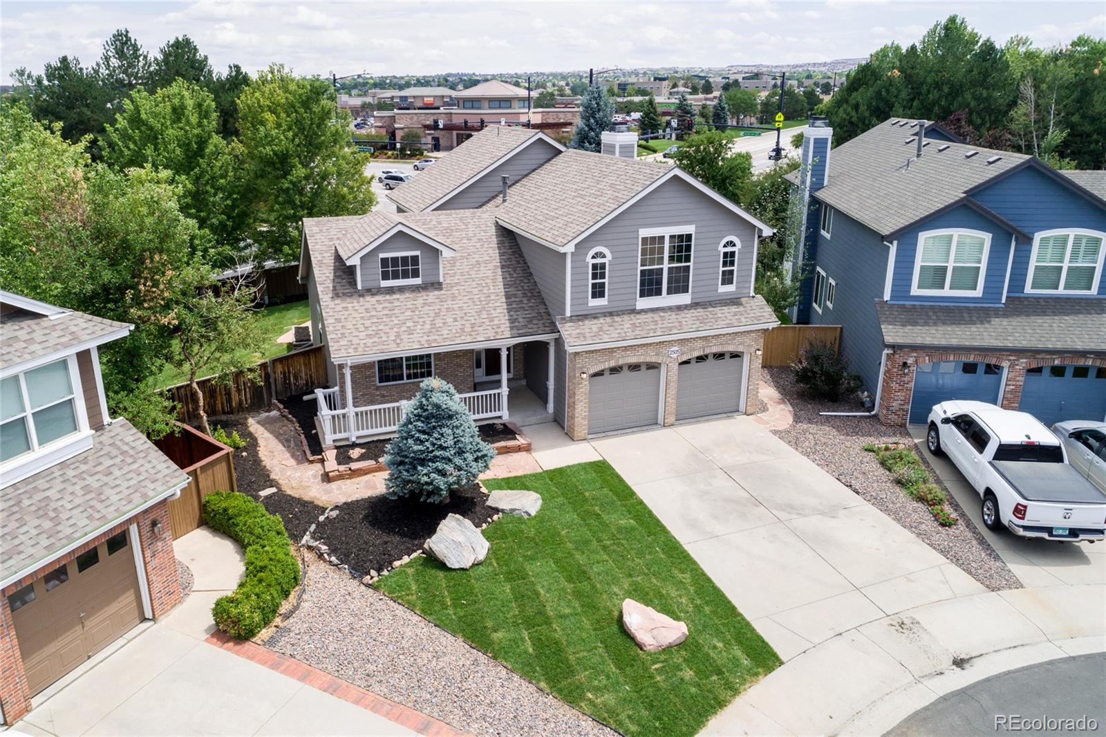2505 Spring Hill Court Highlands Ranch, CO 80129 - Photo 3 of 40 a aerial view of a house with a yard and patio