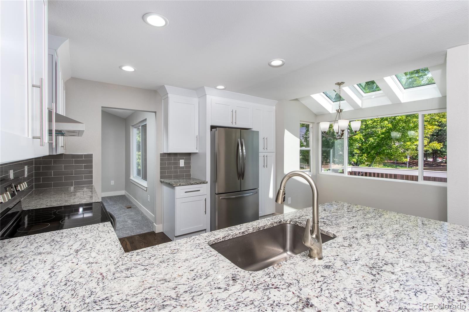 2505 Spring Hill Court Highlands Ranch, CO 80129 - Photo 6 of 40 a kitchen with a refrigerator and a sink