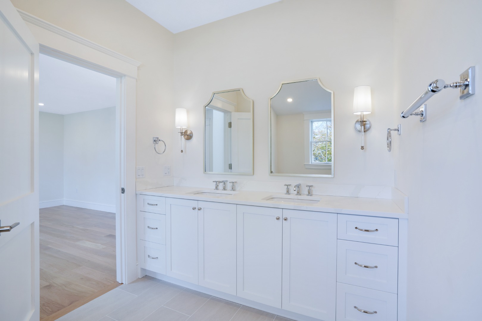 23 Pinehurst Road Edgartown, MA 02539 - Photo 44 of 57 a bathroom with a double vanity sink and a mirror