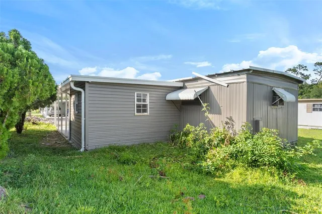 a backyard of a house with lots of green space