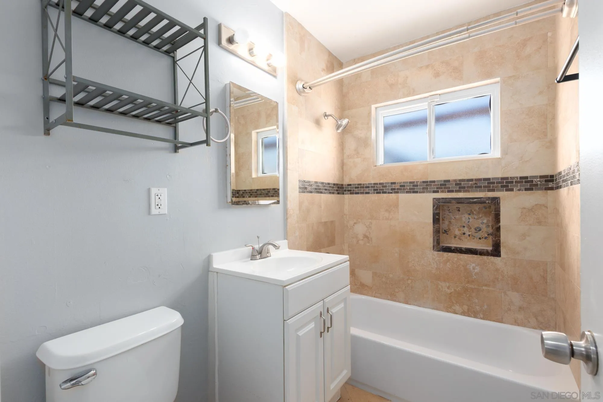 909 North Midway Drive Escondido, CA 92027 - Photo 15 of 19 a bathroom with a sink a toilet and shower