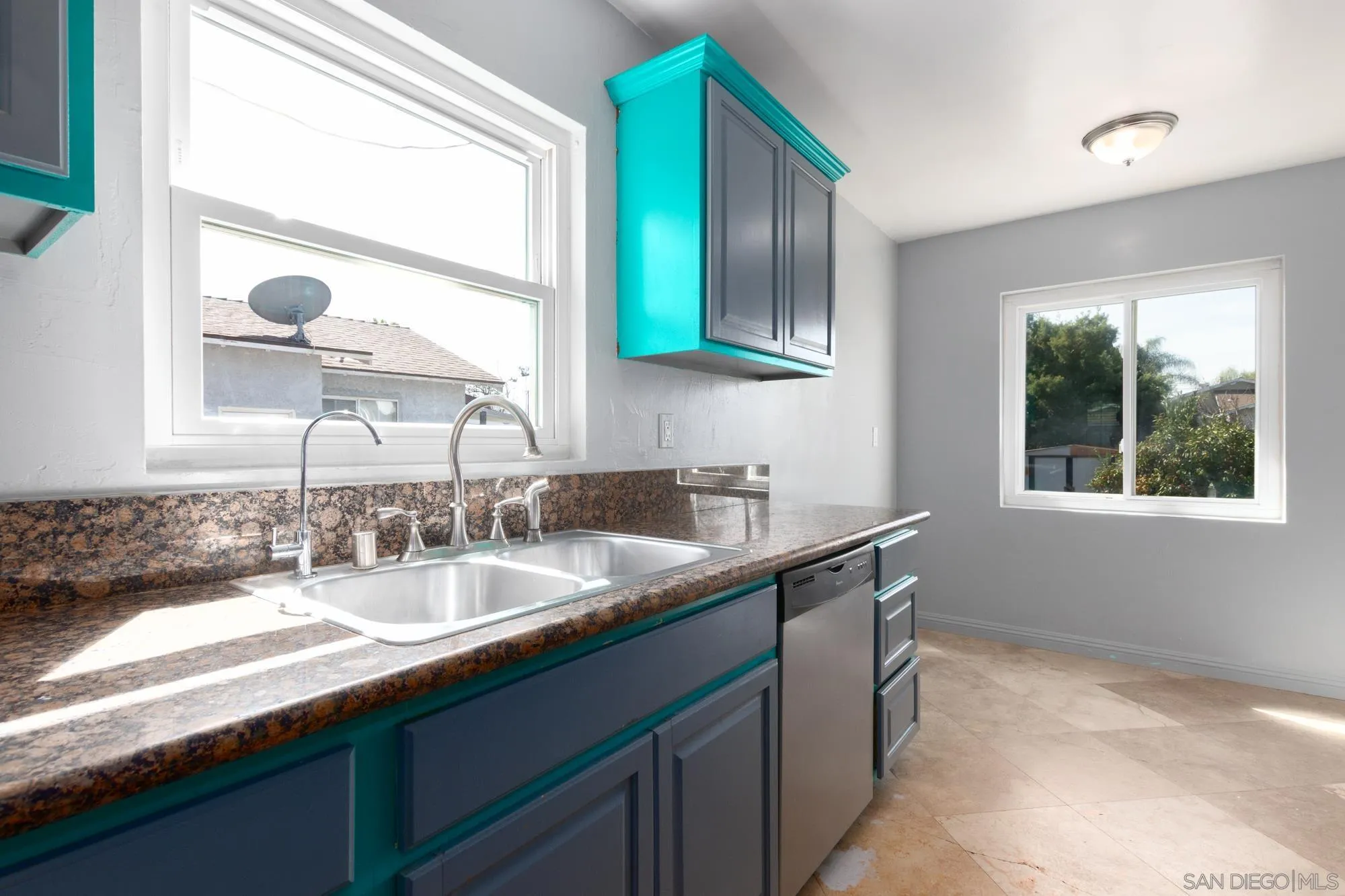 909 North Midway Drive Escondido, CA 92027 - Photo 2 of 19 a kitchen with a sink and a window