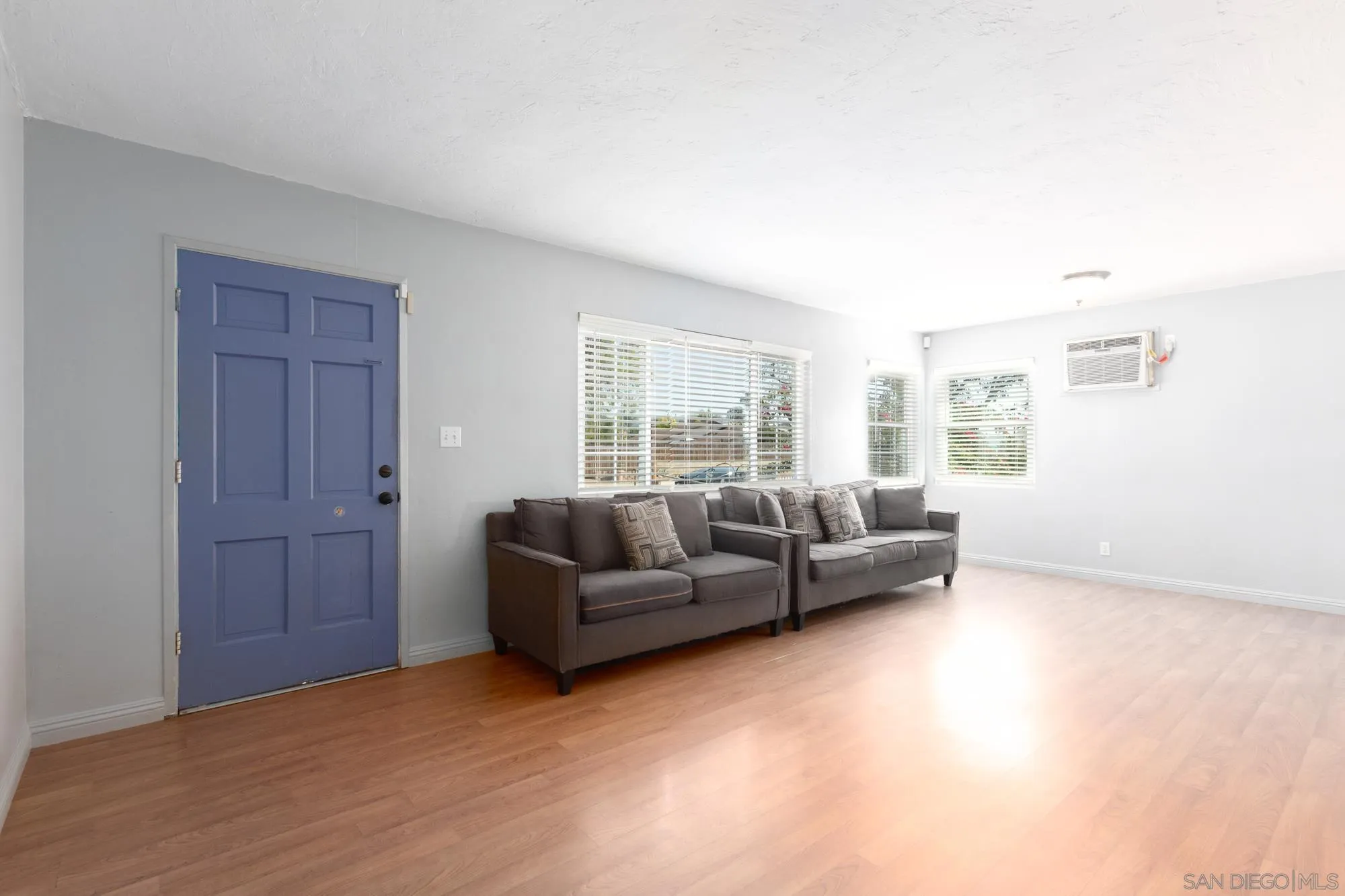909 North Midway Drive Escondido, CA 92027 - Photo 5 of 19 a living room with furniture and a window