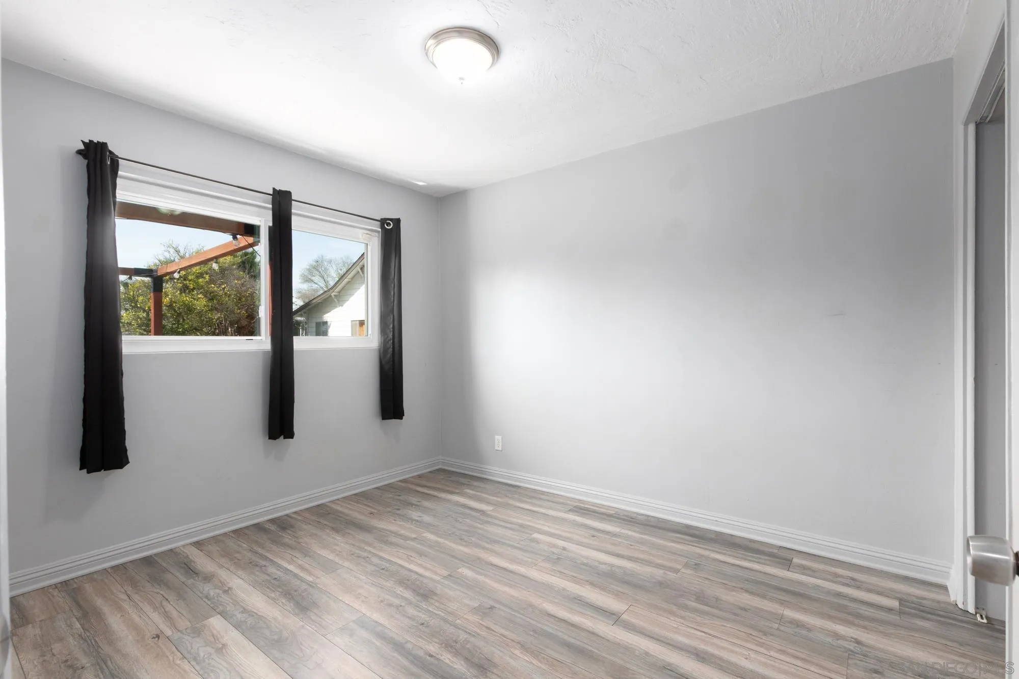 909 North Midway Drive Escondido, CA 92027 - Photo 9 of 19 an empty room with window