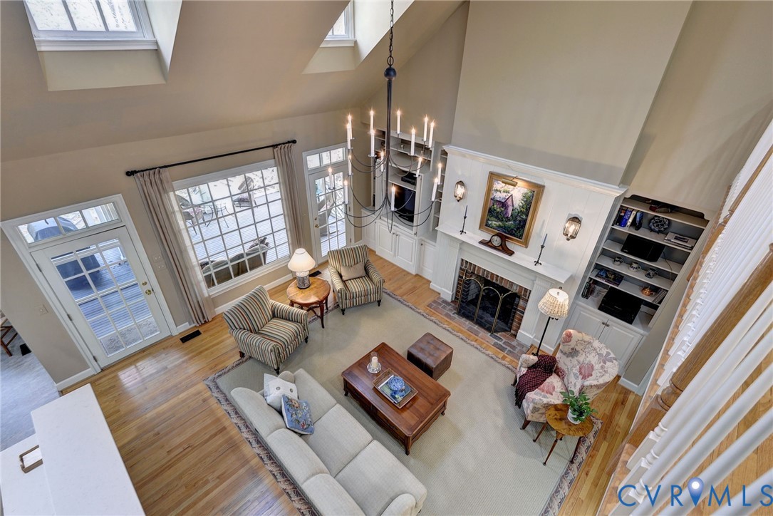 1613 River Ridge Williamsburg, VA 23185 - Photo 42 of 82 Living area with a high ceiling, light wood finish